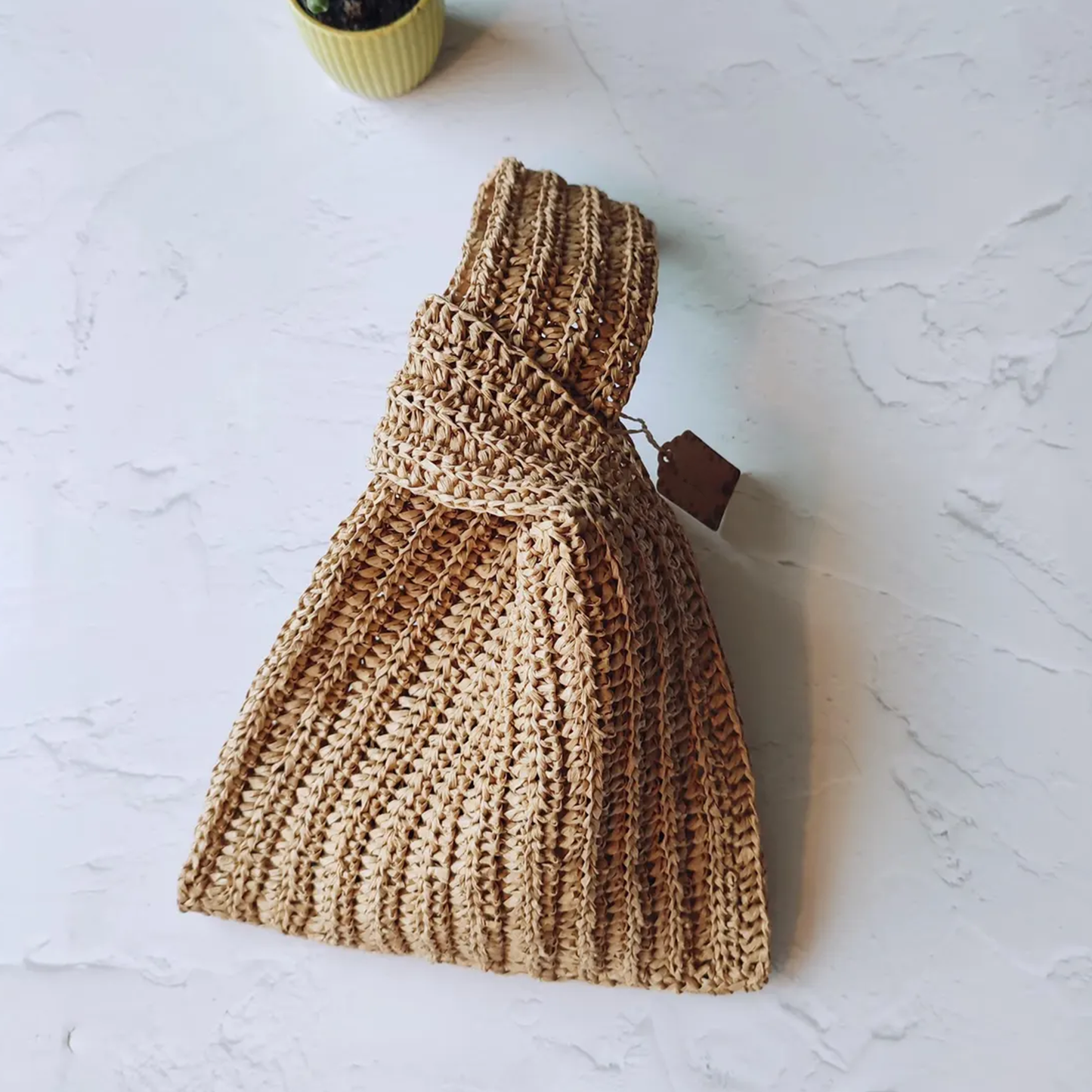 Warm Beige Vertical Ribbed Woven Knotted Hand Pouch With Integrated Loop Handle, Foldable Flexible Silhouette And Single Spacious Inner Storage Cavity