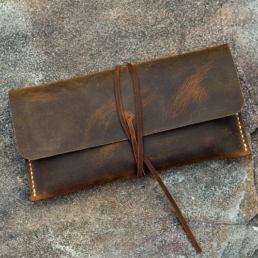 Weathered Vintage Brown Envelope Style Slim Pouch With Wrap-Around Fastening Cord, Warm Toned Edge Stitching And Single Unsegmented Inner Storage Cavity