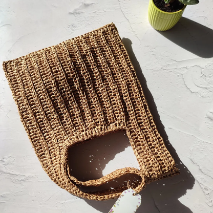 Warm Beige Vertical Ribbed Woven Knotted Hand Pouch With Integrated Loop Handle, Foldable Flexible Silhouette And Single Spacious Inner Storage Cavity
