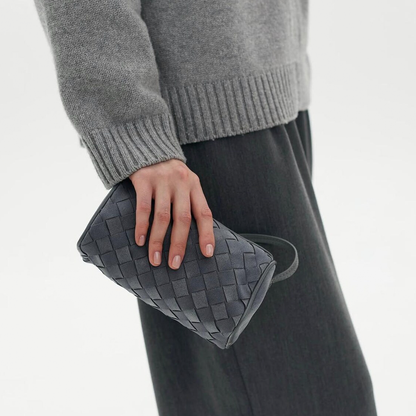 Muted Ash Grey Slim Rectangular Woven Mini Carryall With Tight Interlaced Grid Texturing, Soft Rounded Edge Trim And Slim Side Attached Hanging Strip