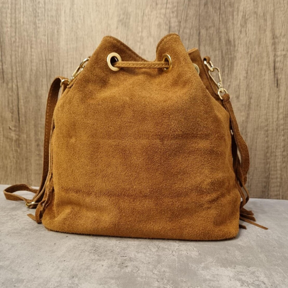 Warm Caramel Tan Slouchy Fringe Trim Bucket Pouch With Drawstring Eyelet Closure, Polished Side Clasps And Single Lengthy Hanging Strap