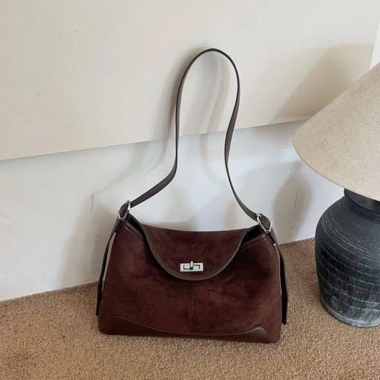 Deep Chocolate Brown Curved Hobo Carryall With Textured Front Panels, Smooth Bottom Trim And Rectangular Metallic Flap Twist Lock